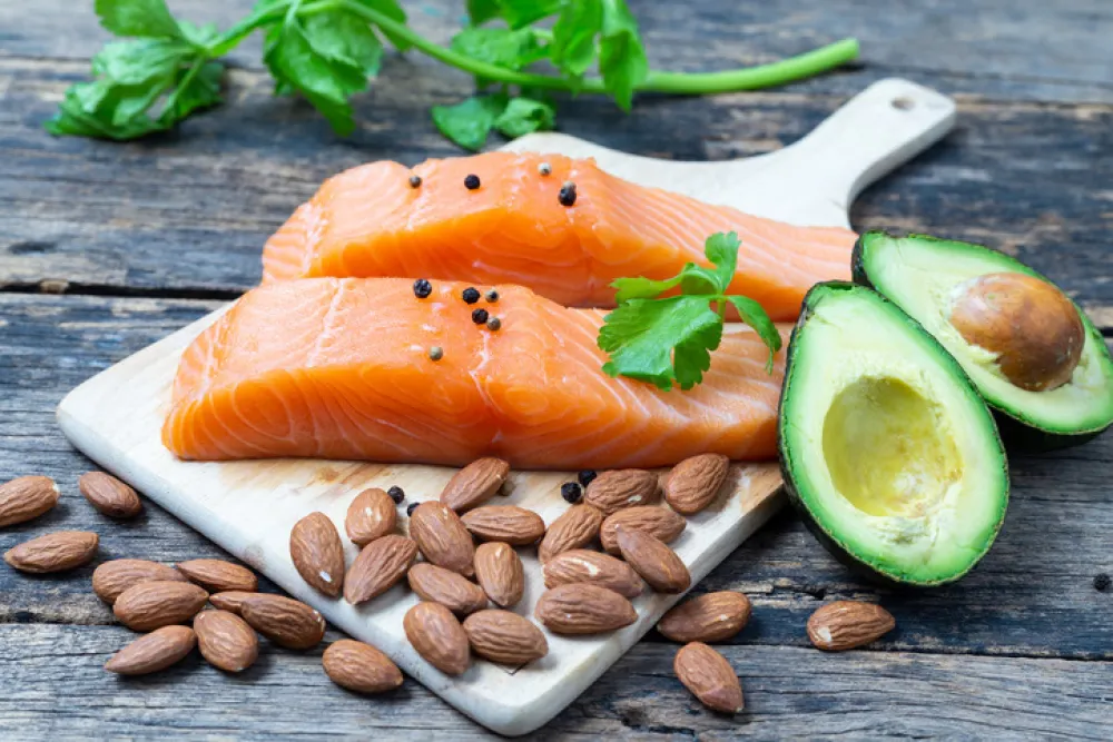Raw Salmon with Almond and Avocado on a wooden table,healthy food Concept
