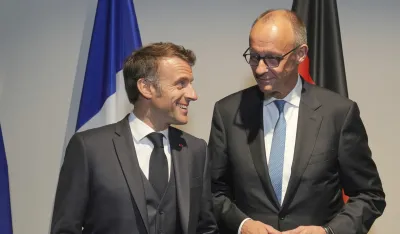 Emanuel Makron i Fridrih Merc